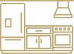 Modern kitchenette with a small refrigerator, countertop, and cabinets, located in a residential living space.